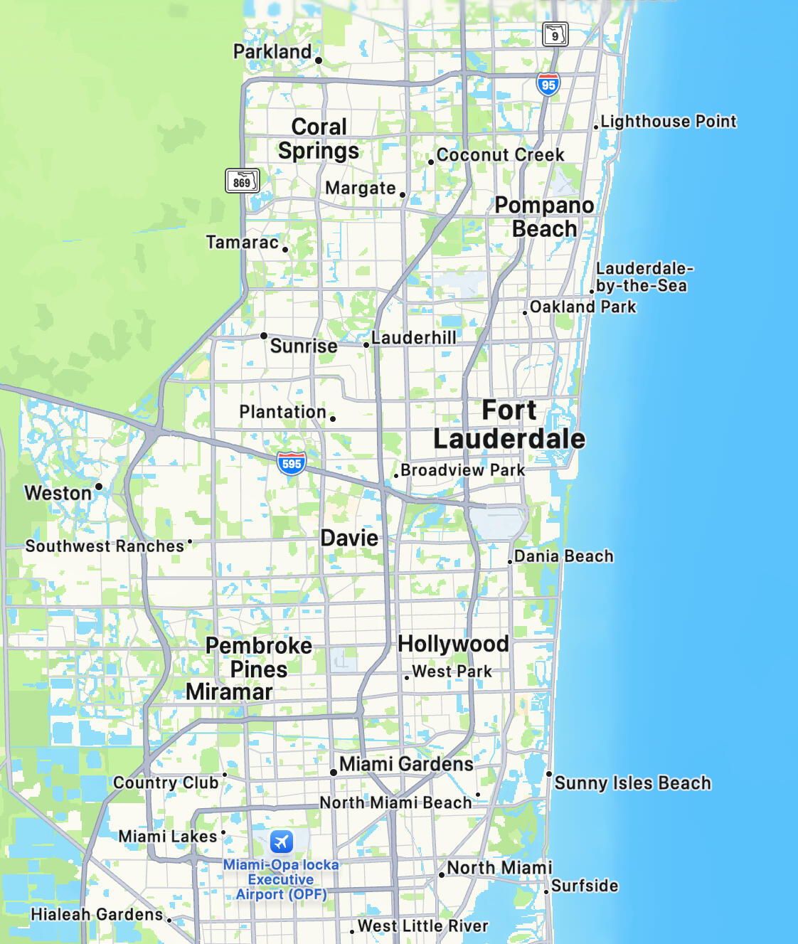 Close up of luxury material samples including walnut wood slats, navy panel, brass hardware, Calacatta marble and Venetian plaster textures